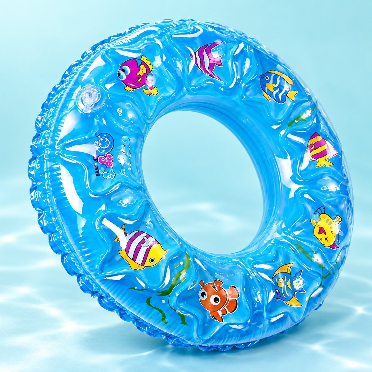 Detail of blue RIO+ inflatable swim ring with fish print